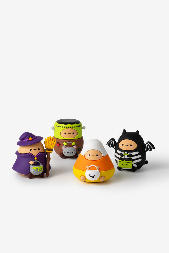 Set of Halloween-themed figurines on a white background